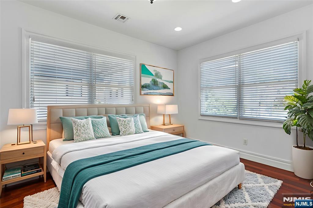 52 Myrtle Avenue, Unit B Edgewater, NJ 07020 - Photo 10 of 20 a bedroom with a bed and a window