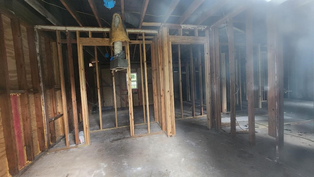 26835 Long Street Splendora, TX 77372 - Photo 11 of 16 a view of outdoor space and wooden door