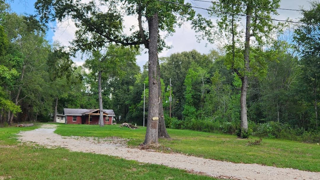 26835 Long Street Splendora, TX 77372 - Photo 4 of 16 a view of a garden with a fountain