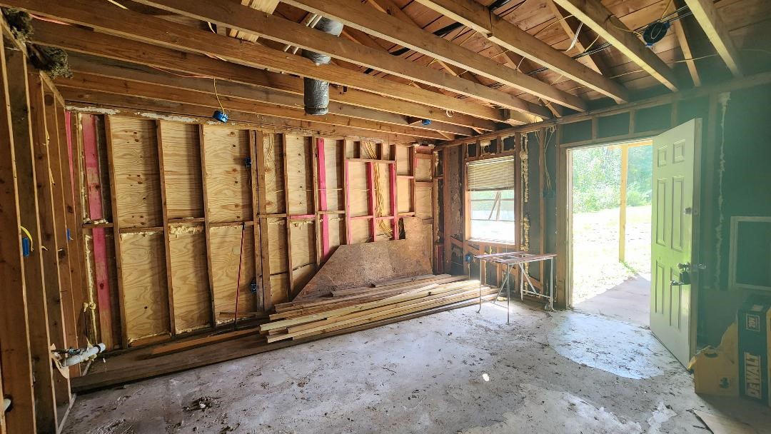 26835 Long Street Splendora, TX 77372 - Photo 7 of 16 a view of porch with a wooden door