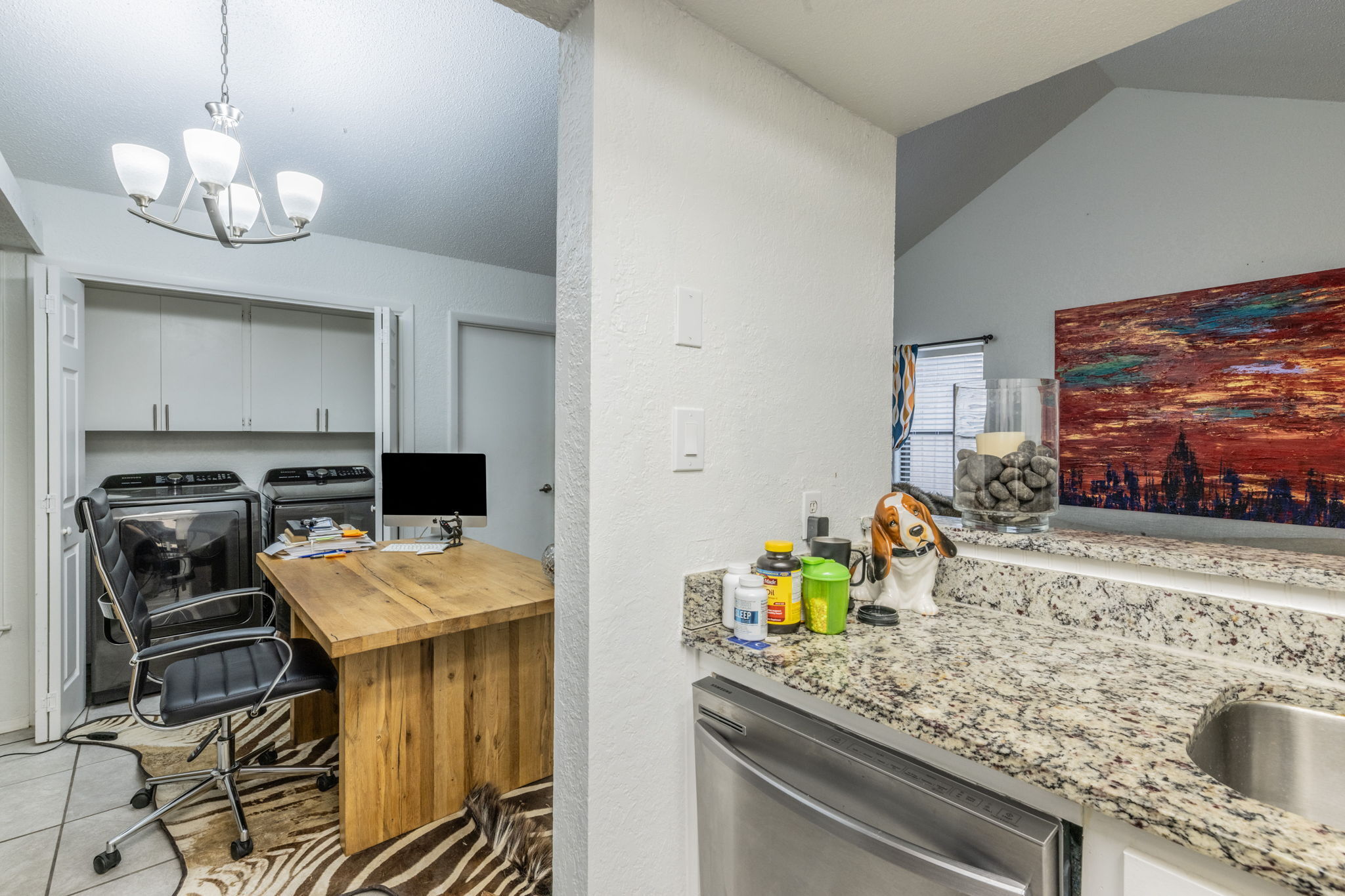 1008 Milford Way Austin, TX 78745 - Photo 28 of 40 Dedicated laundry area with upper cabinetry and bi-fold doors