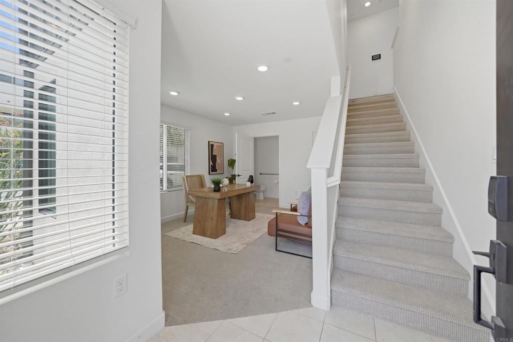 2402 Cascalote Loop San Diego, CA 92154 - Photo 16 of 35 a view of a hallway with the kitchen and entryway