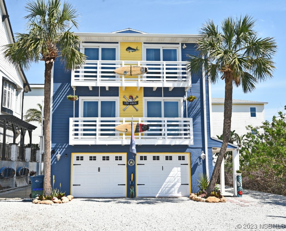 6531 Turtlemound Road New Smyrna Beach, FL 32169 - Photo 38 of 42 a front view of a building with windows