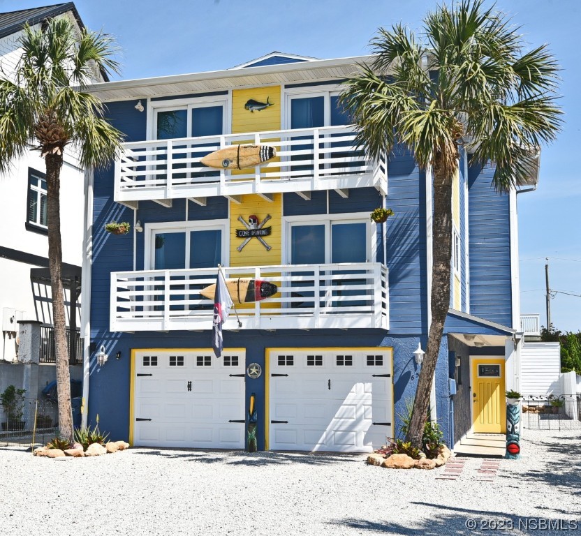 6531 Turtlemound Road New Smyrna Beach, FL 32169 - Photo 39 of 42 a front view of a building with windows