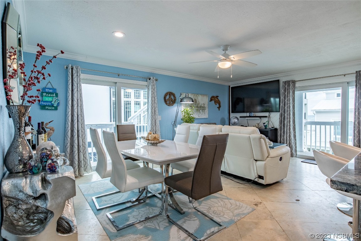 6531 Turtlemound Road New Smyrna Beach, FL 32169 - Photo 8 of 42 a view of a livingroom with furniture and a potted plant