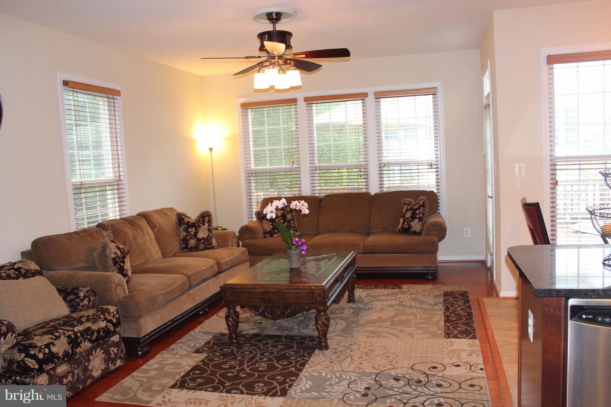 9168 Furey Road Lorton, VA 22079 - Photo 13 of 29 Family Room off kitchen with fireplace