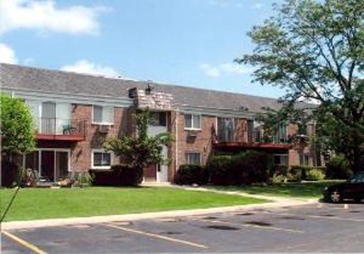 10369 Dearlove Road, Unit 1C Glenview, IL 60025 - Photo 1 of 9 a front view of house with a garden