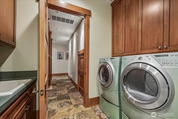 a view of a kitchen with washer and dryer