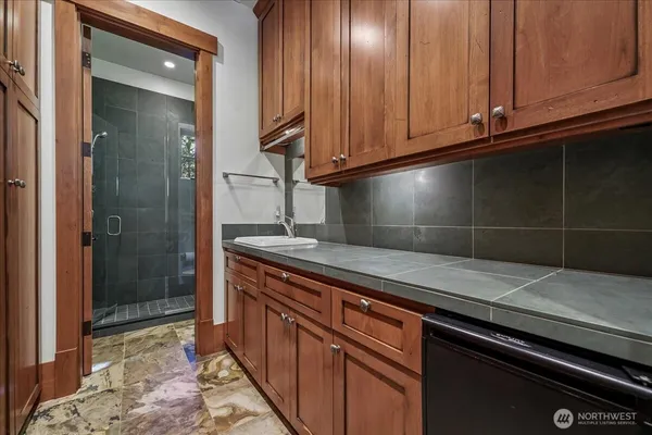 a view of a refrigerator and cabinets
