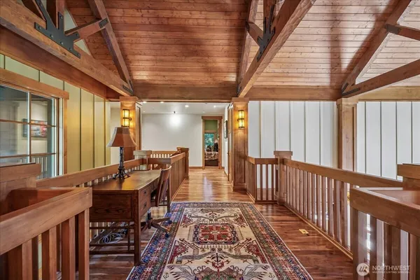 a view of a hall with wooden floor