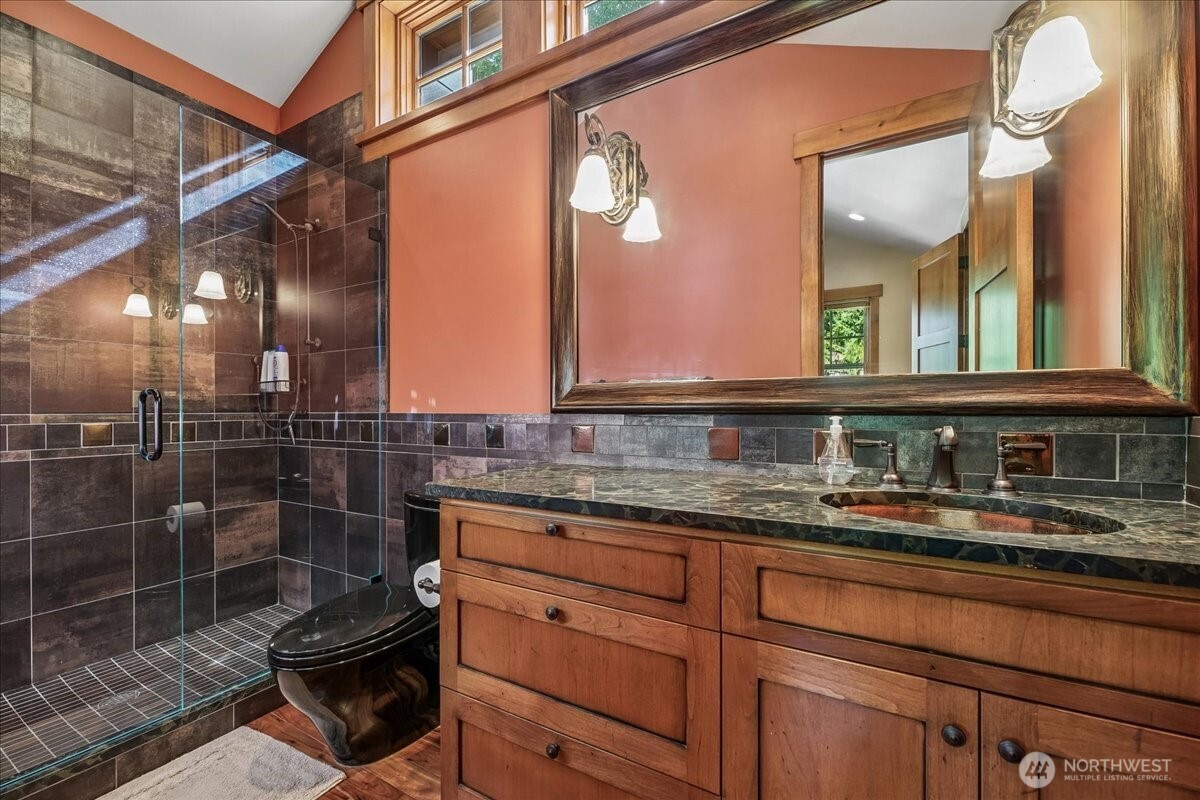 50 Larkspur Loop Cle Elum, WA 98922 - Photo 26 of 36 a bathroom with a granite countertop sink a toilet and a mirror