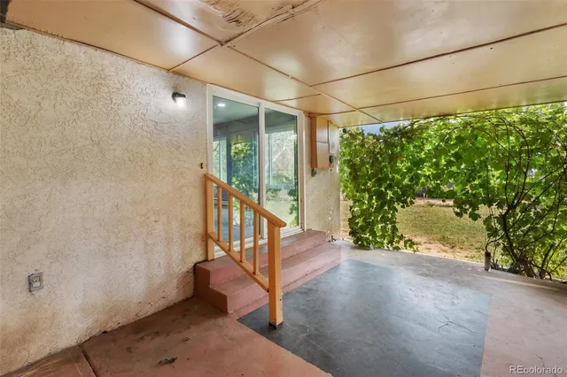 a view of a porch with wooden floor and outdoor space