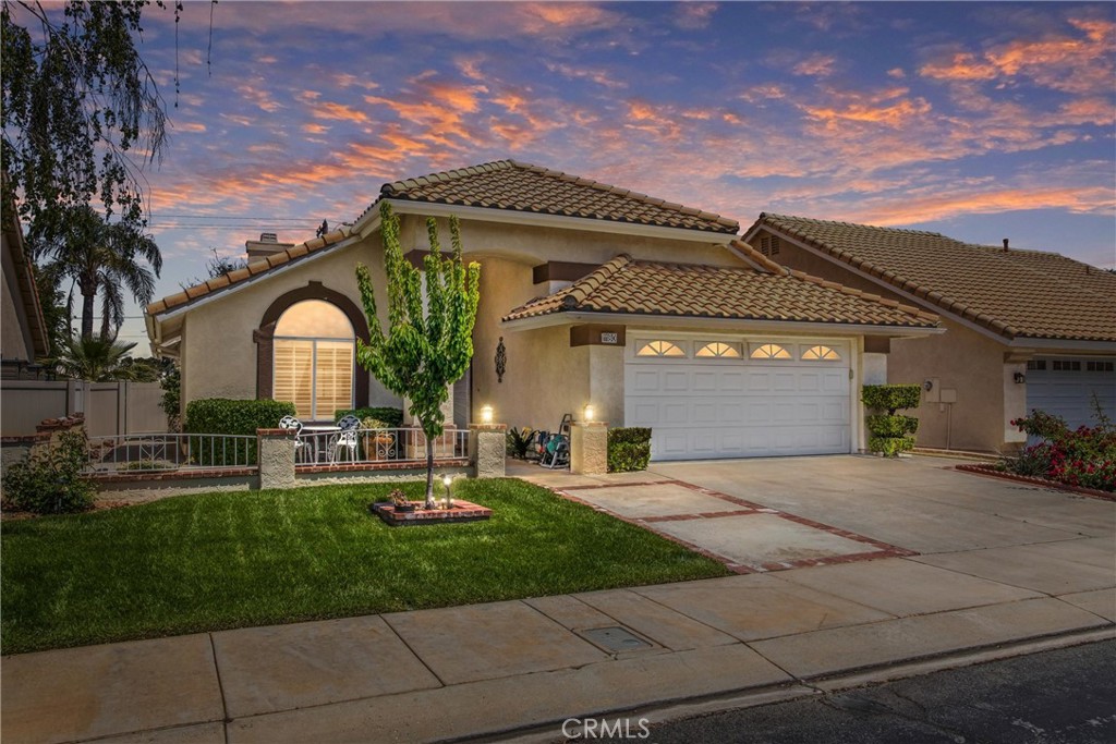 1180 South Bay Hill Road Banning, CA 92220 - Photo 1 of 1 a front view of a house with garden and trees