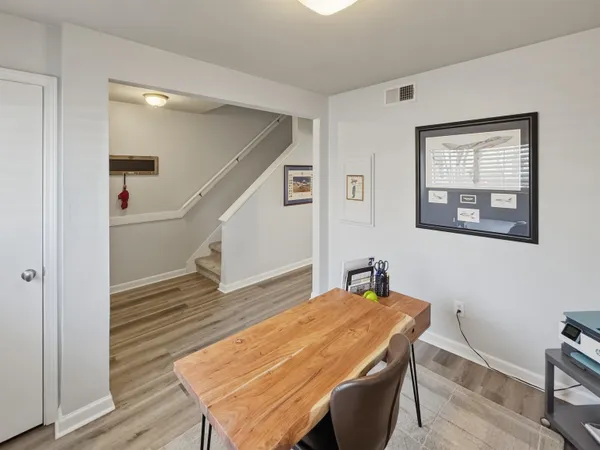 a room with wooden floor and table