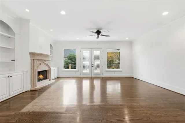 a bathroom with a granite countertop toilet a sink and mirror