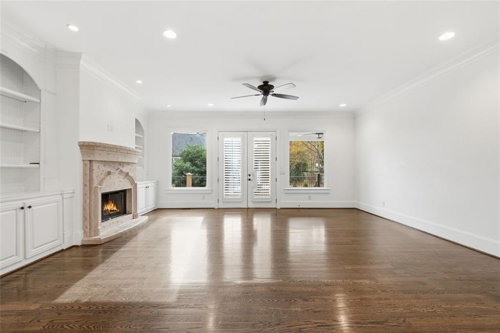 7611 Regency Circle Sandy Springs, GA 30350 - Photo 20 of 74 a view of an empty room with a fireplace and window