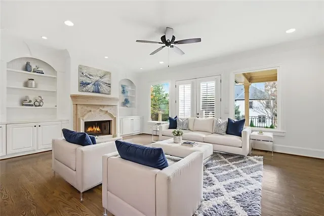 a view of a big room with wooden floor and a large window