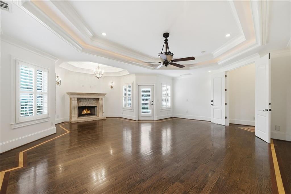 7611 Regency Circle Sandy Springs, GA 30350 - Photo 25 of 74 a view of an empty room with a fireplace and a window