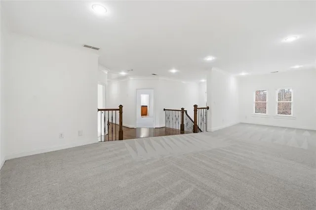 a bathroom with a double vanity sink toilet mirror and shower