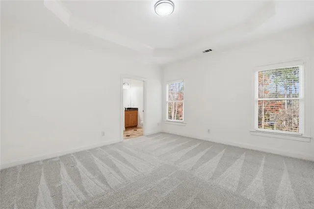 a kitchen with stainless steel appliances granite countertop a sink and a refrigerator