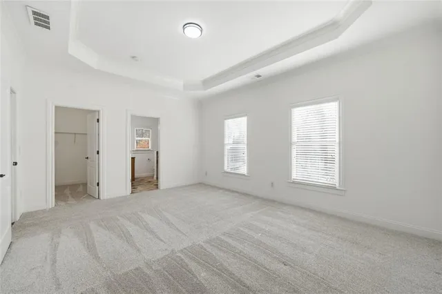 a kitchen with stainless steel appliances a stove top oven and a refrigerator