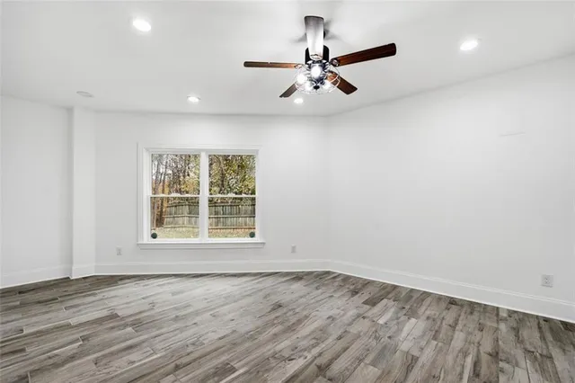 a bathroom with a sink mirror vanity and a shower
