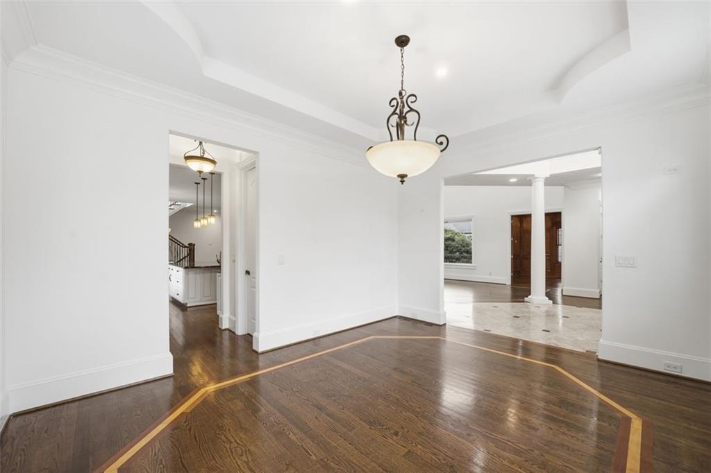 7611 Regency Circle Sandy Springs, GA 30350 - Photo 5 of 74 a view of empty room with wooden floor