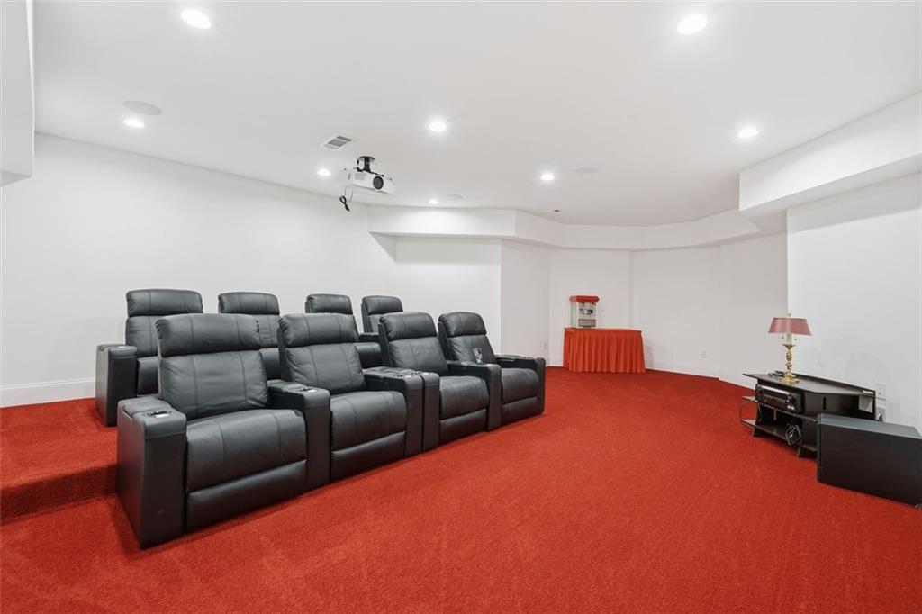 7611 Regency Circle Sandy Springs, GA 30350 - Photo 53 of 74 a living room with furniture and a chandelier