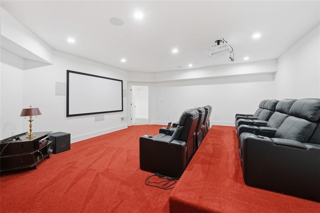 7611 Regency Circle Sandy Springs, GA 30350 - Photo 54 of 74 a living room with furniture and a flat screen tv