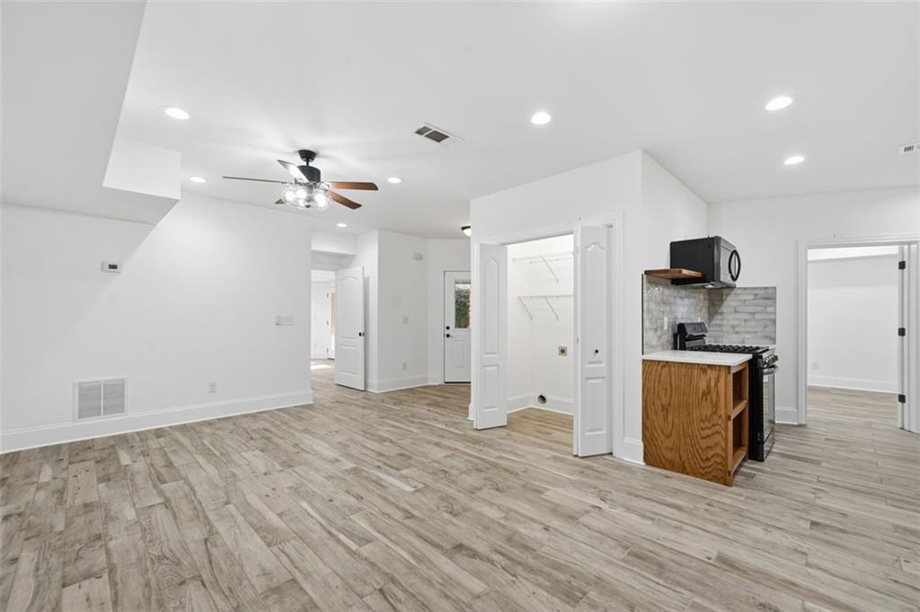7611 Regency Circle Sandy Springs, GA 30350 - Photo 67 of 74 a view of an empty room with a kitchen