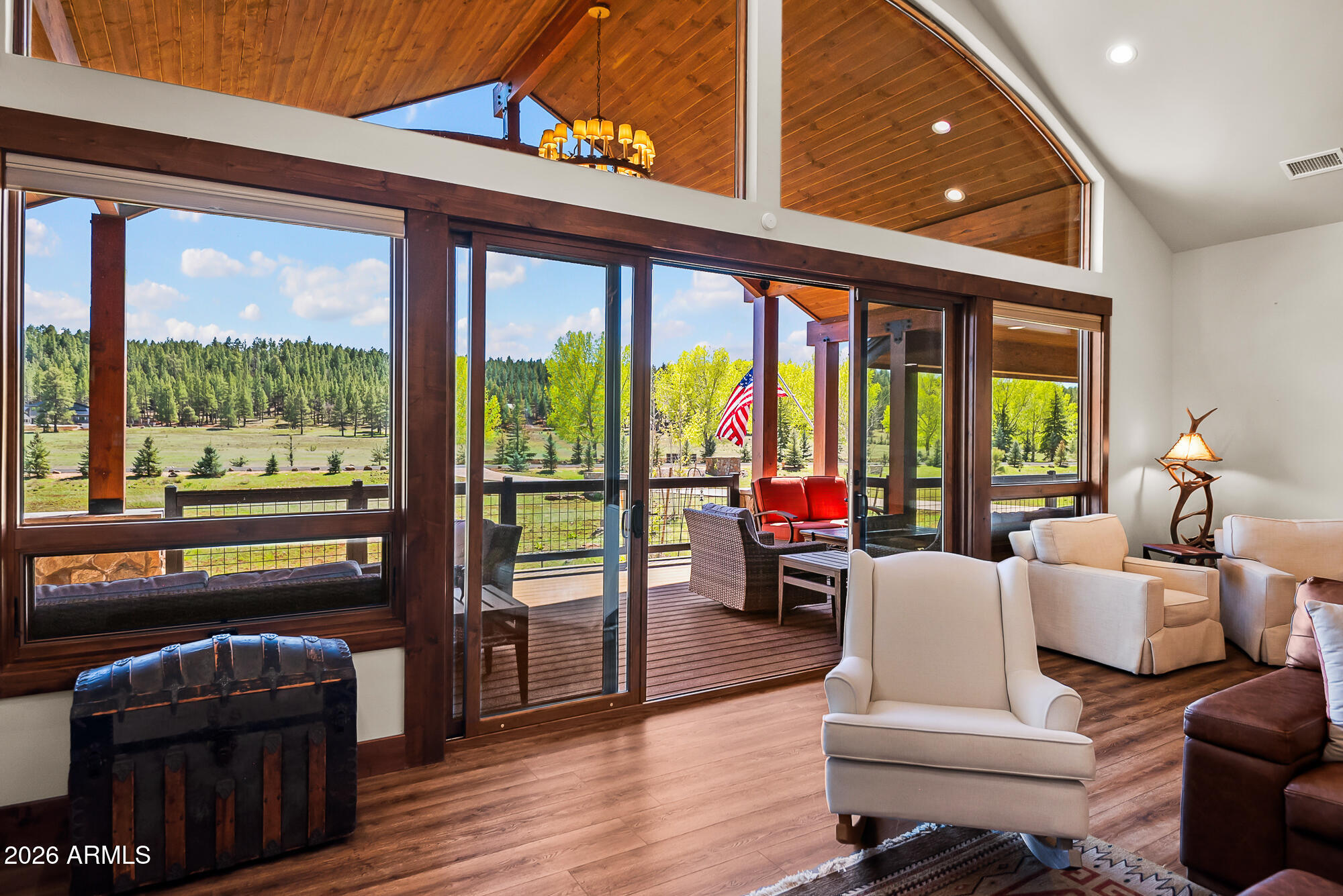 405 East Foxboro Road Munds Park, AZ 86017 - Photo 17 of 131 a living room with furniture and a floor to ceiling window