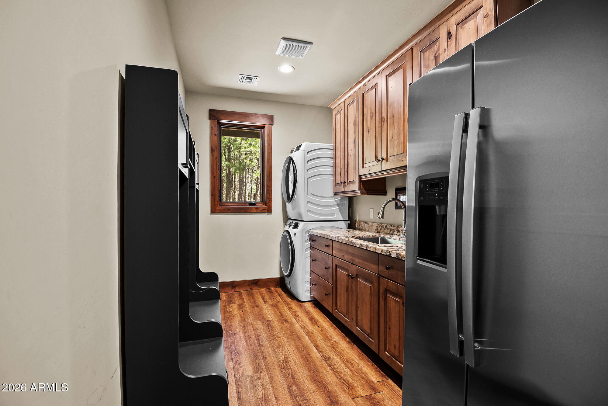 405 East Foxboro Road Munds Park, AZ 86017 - Photo 40 of 131 a kitchen with stainless steel appliances granite countertop a refrigerator a stove and a sink