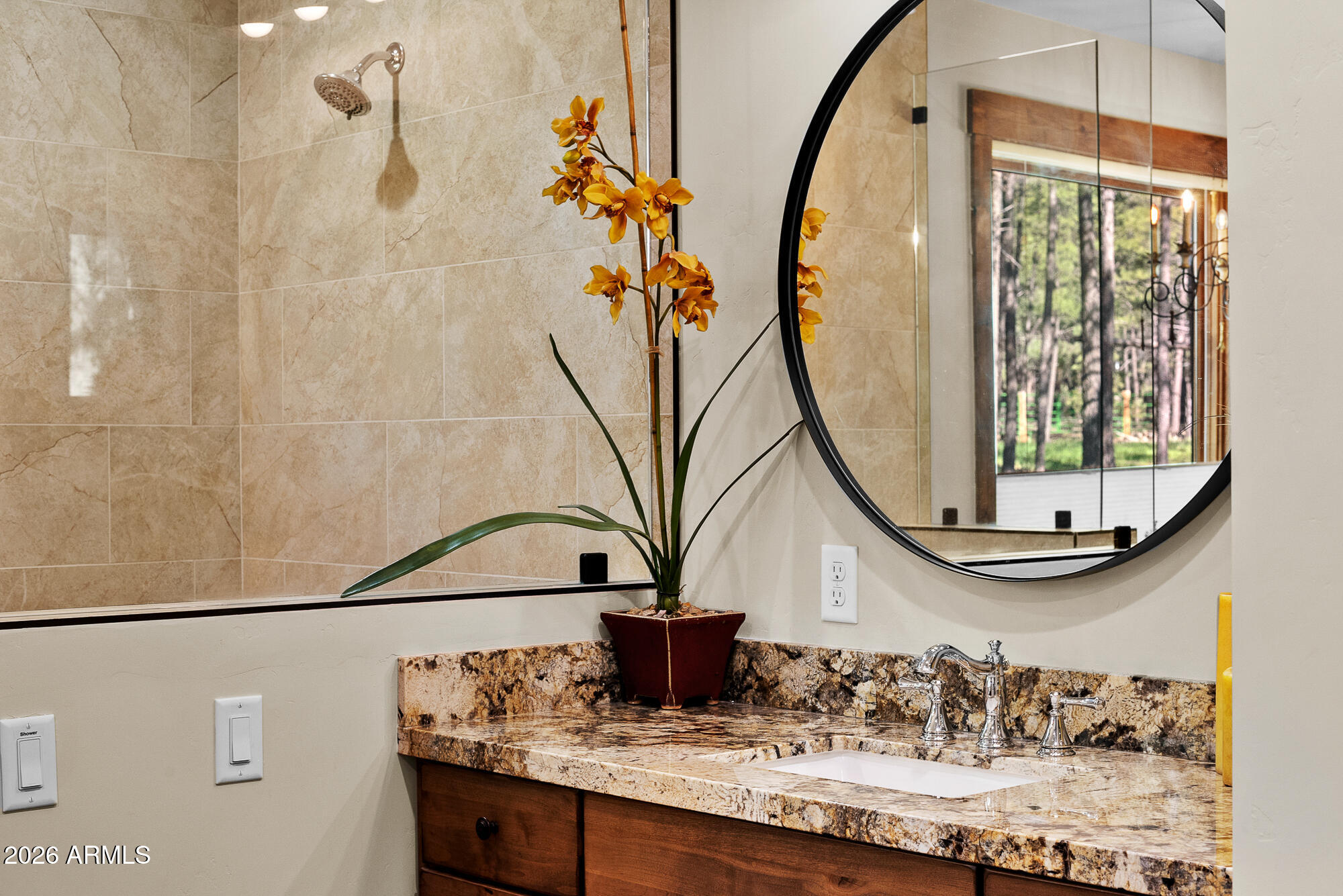 405 East Foxboro Road Munds Park, AZ 86017 - Photo 52 of 131 a view of a bathroom with a sink and mirror