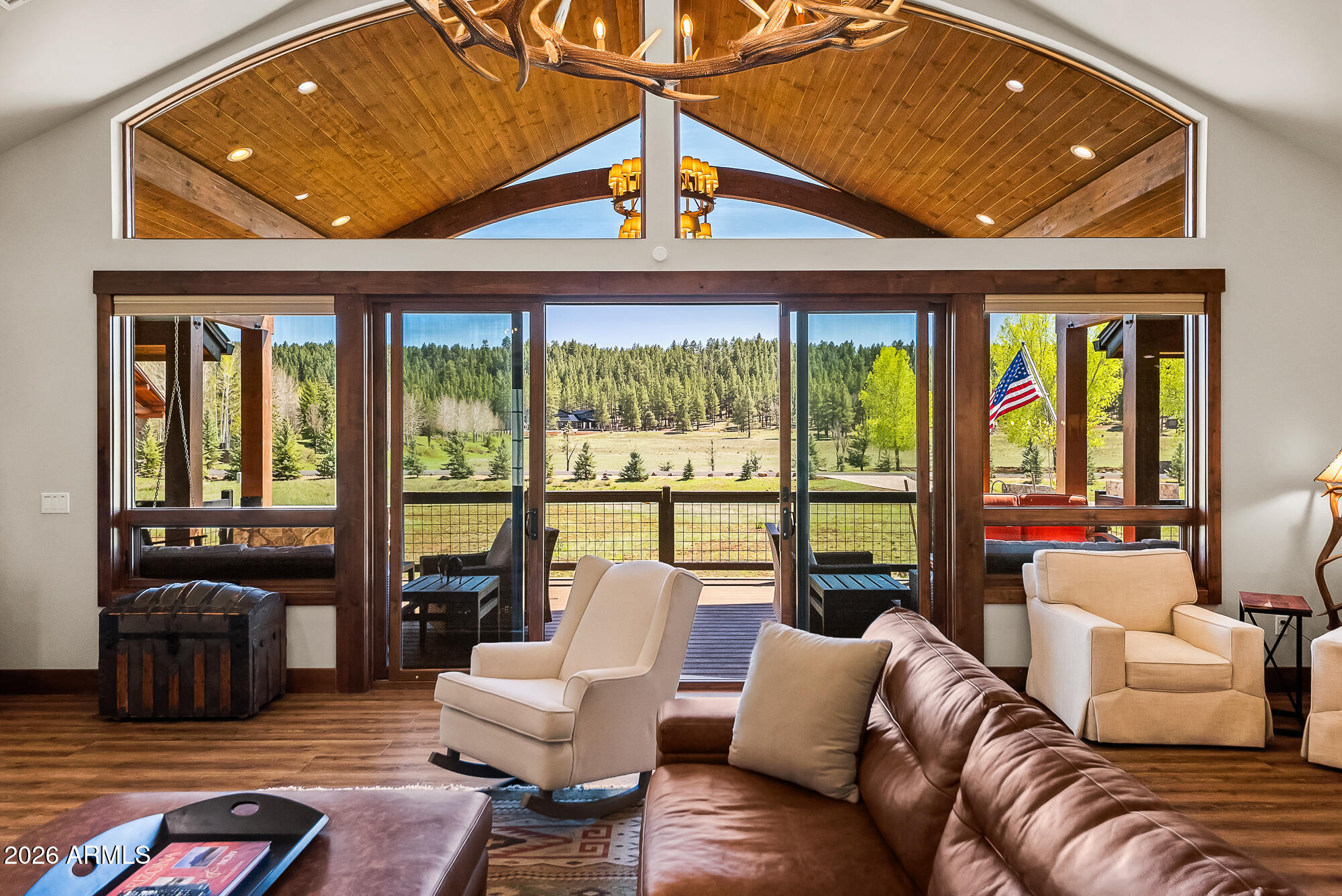 405 East Foxboro Road Munds Park, AZ 86017 - Photo 60 of 131 a living room with furniture and floor to ceiling windows