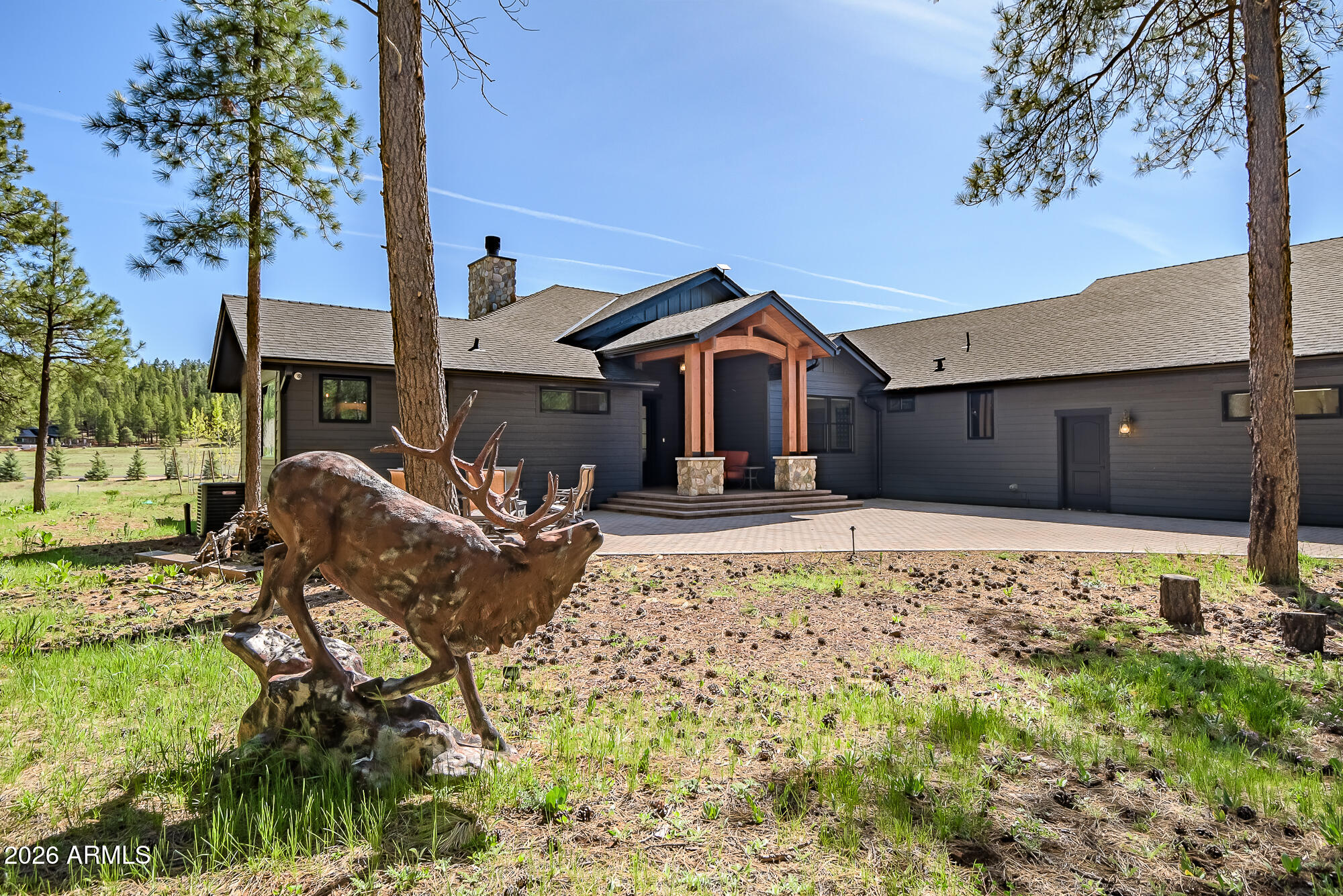 405 East Foxboro Road Munds Park, AZ 86017 - Photo 78 of 131 a front view of a house with garden