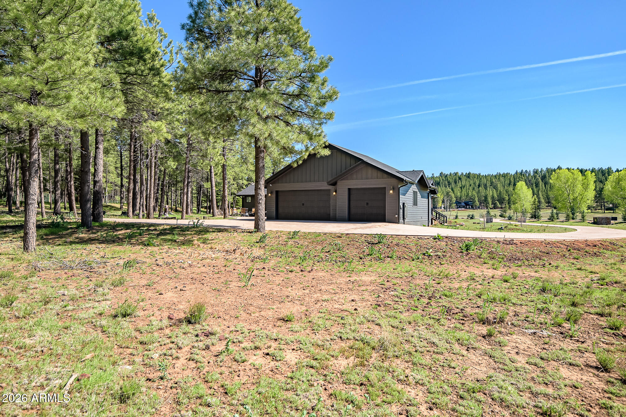 405 East Foxboro Road Munds Park, AZ 86017 - Photo 80 of 131 a house with trees in the background