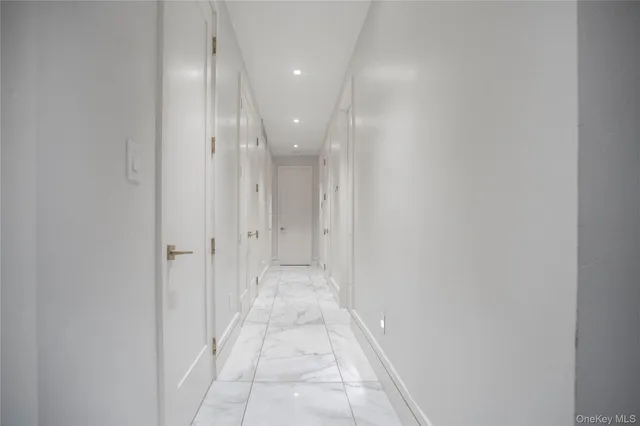 a view of a hallway with closet