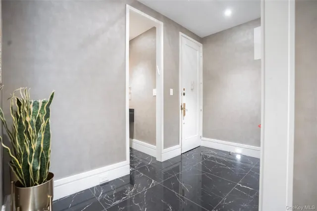 a view of entryway with wooden floor