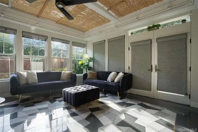 a living room with furniture and a window