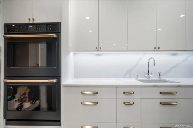 a kitchen with a stove and cabinets
