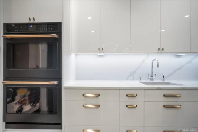a kitchen with a stove and cabinets