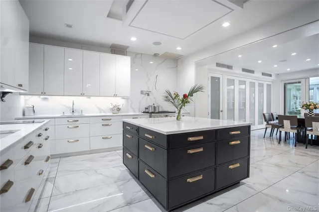a kitchen with cabinets and window