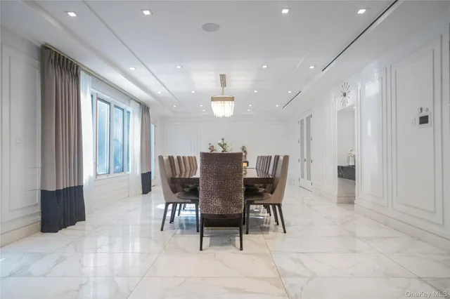 a dining room with furniture and window