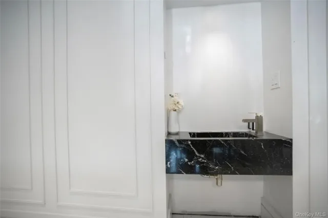 a bathroom with a sink and granite