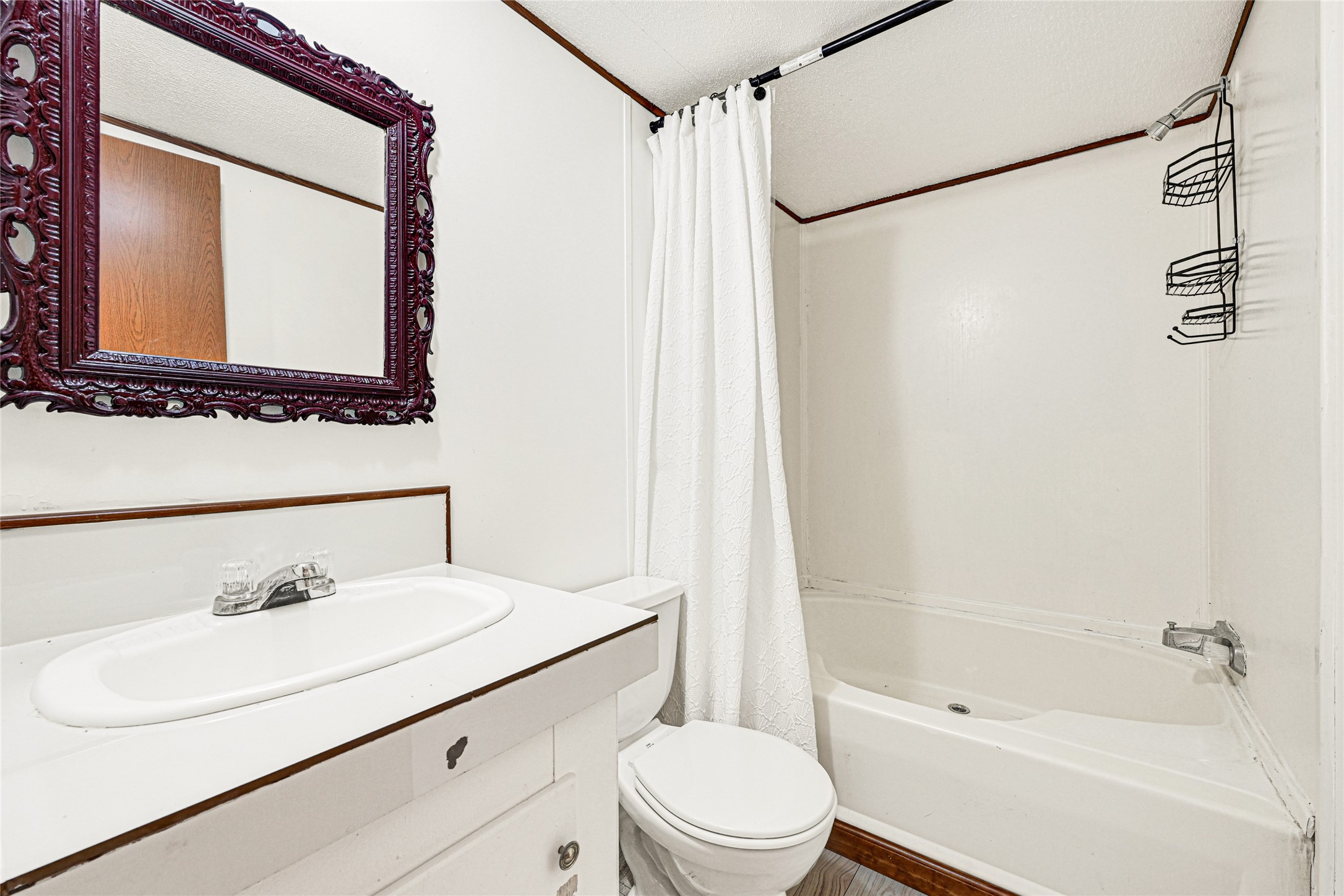 16794 Balmoral Street Montgomery, TX 77316 - Photo 16 of 24 a bathroom with a sink toilet and shower