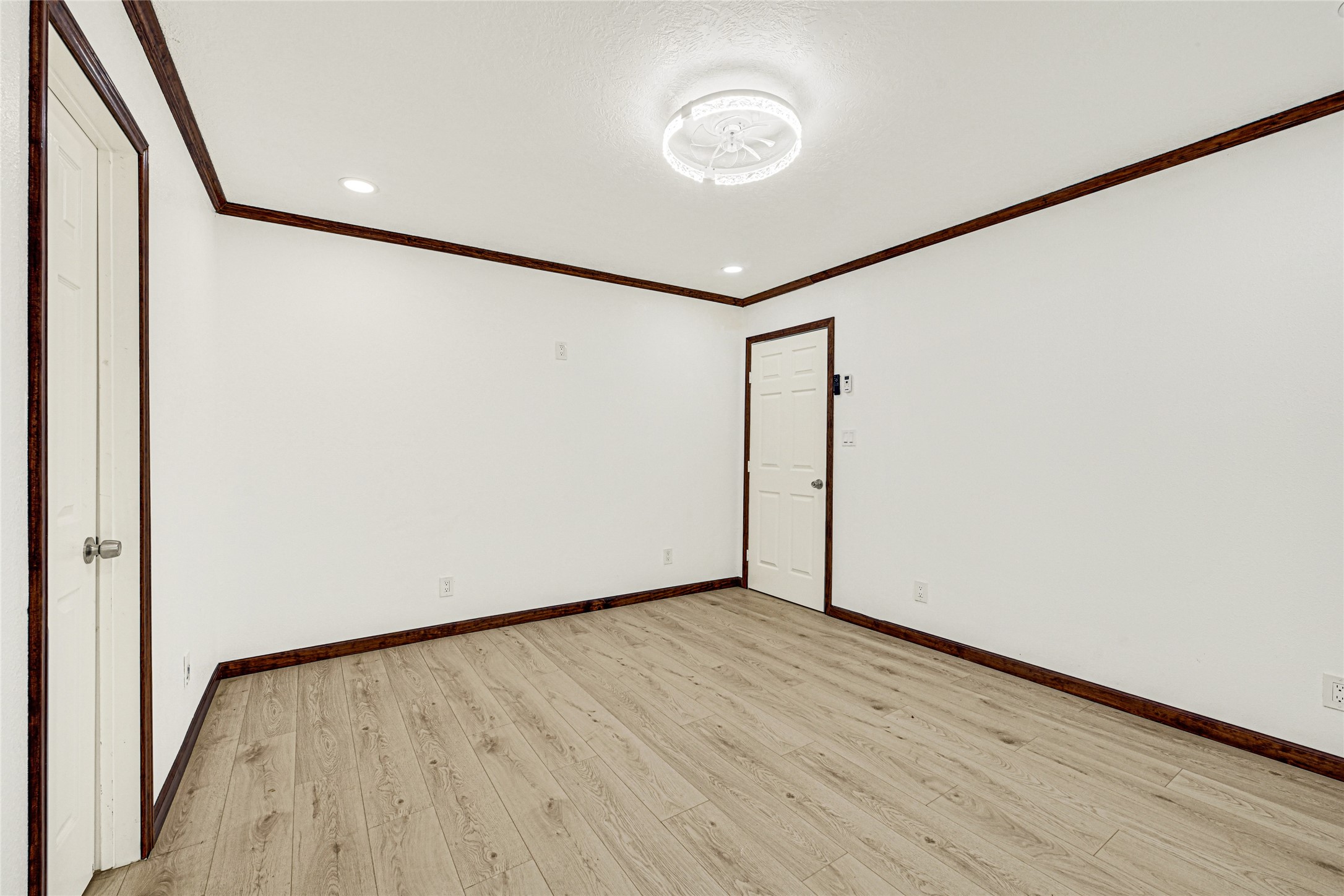 16794 Balmoral Street Montgomery, TX 77316 - Photo 20 of 24 a view of an empty room with wooden floor and a window
