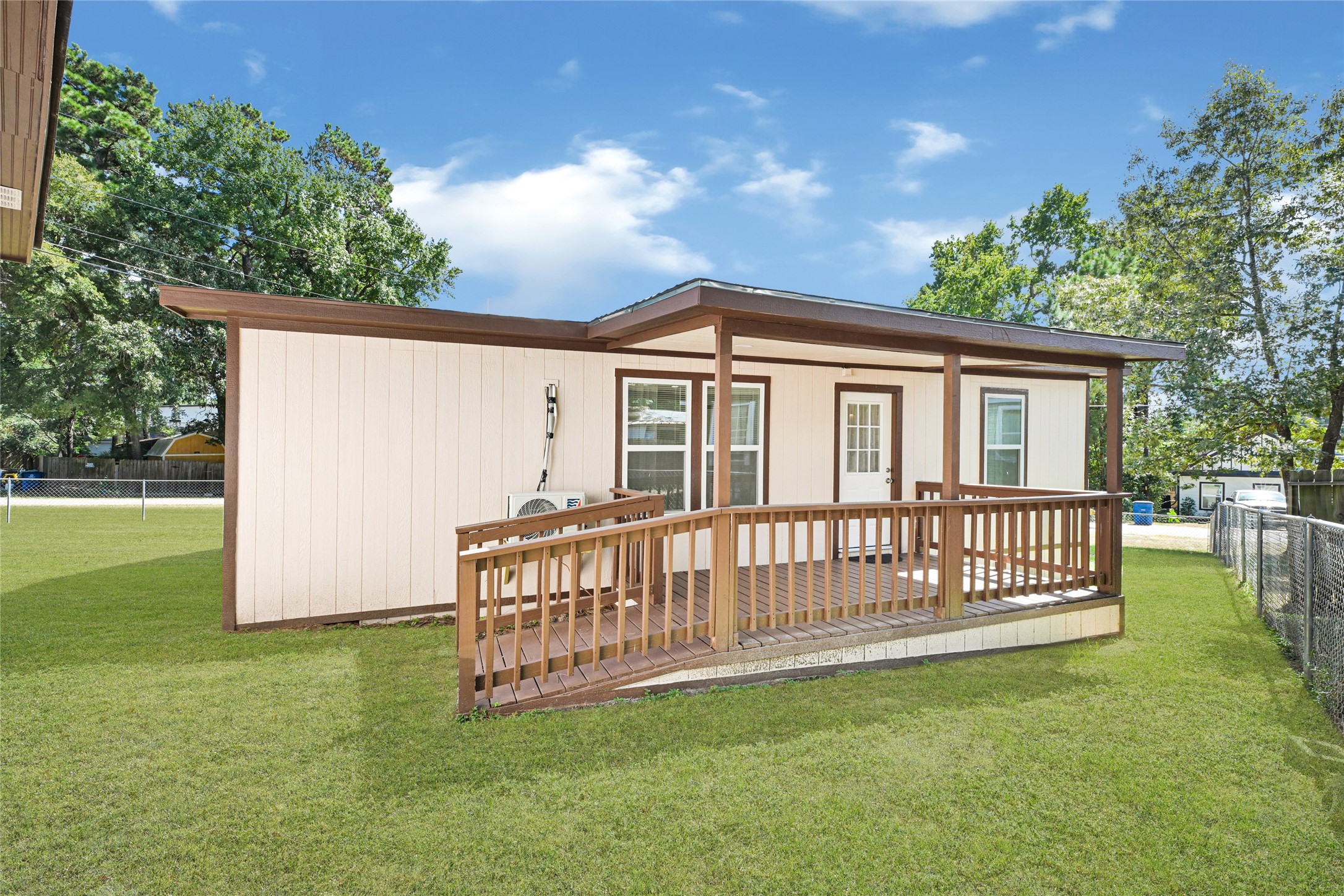 16794 Balmoral Street Montgomery, TX 77316 - Photo 2 of 24 a view of a house with a yard and deck