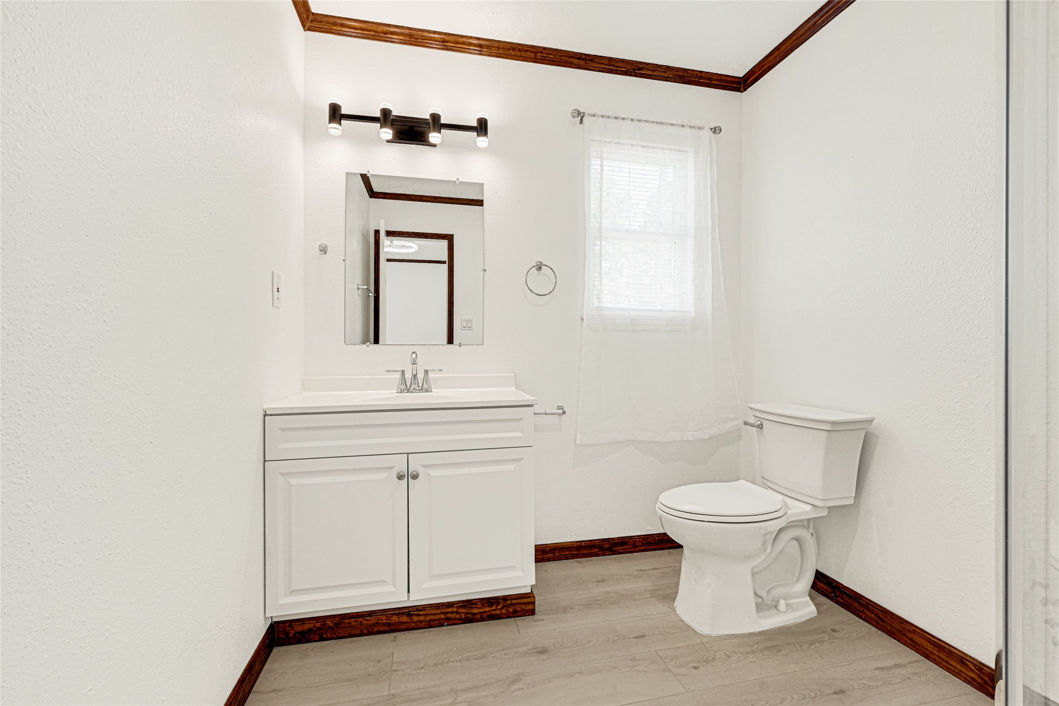 16794 Balmoral Street Montgomery, TX 77316 - Photo 22 of 24 a bathroom with a sink toilet and mirror
