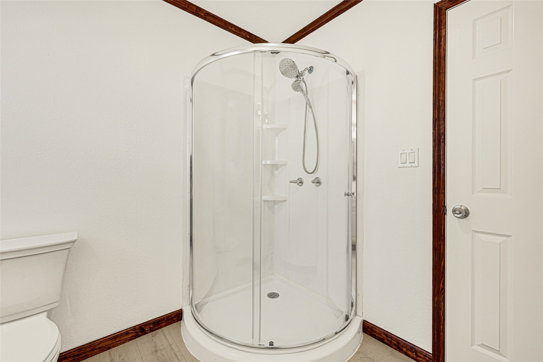 16794 Balmoral Street Montgomery, TX 77316 - Photo 23 of 24 a bathroom with a shower a toilet and a sink