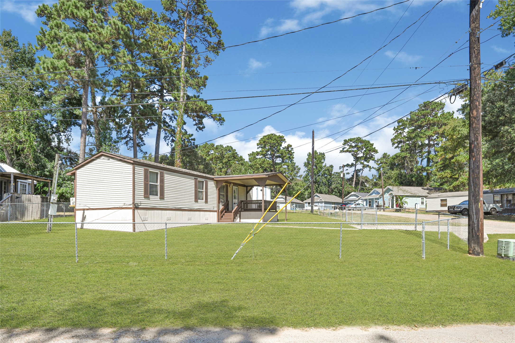 16794 Balmoral Street Montgomery, TX 77316 - Photo 24 of 24 a view of an house with backyard space and swimming pool